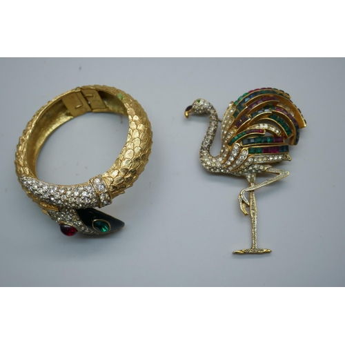 896 - A vintage Butler & Wilson gold plated snake bracelet with diamanté detail and red and gold stones an... 