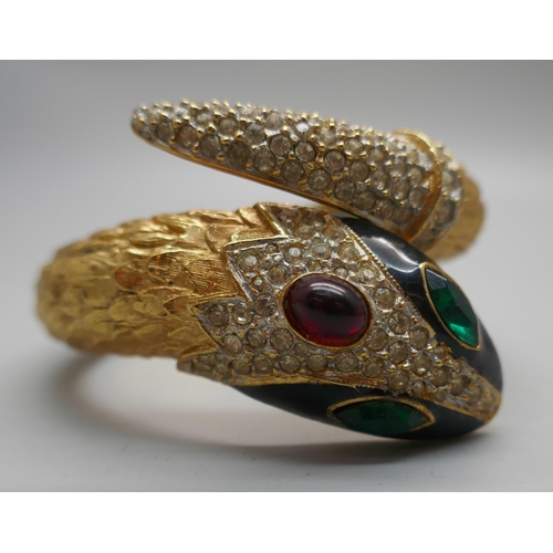 896 - A vintage Butler & Wilson gold plated snake bracelet with diamanté detail and red and gold stones an... 