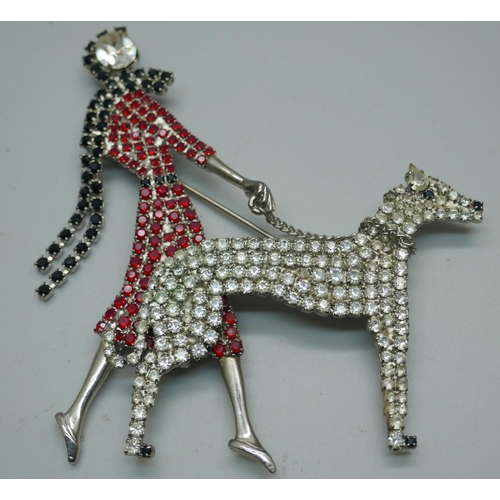 897 - A large Butler & Wilson articulated brooch of a lady walking a dog with red, white and black rhinest... 