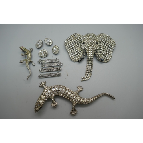 900 - A large Butler & Wilson silver plated rhinestone elephant's head brooch with articulated trunk, a vi... 