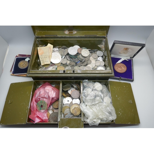 913 - A large collection of 6d coins and other mixed coins in a cash tin