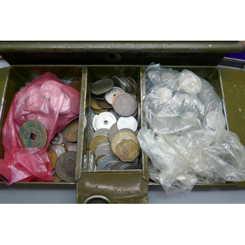 913 - A large collection of 6d coins and other mixed coins in a cash tin