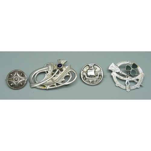 929 - A hallmarked Scottish silver brooch with thistle detail, two other silver brooches and an unmarked b... 