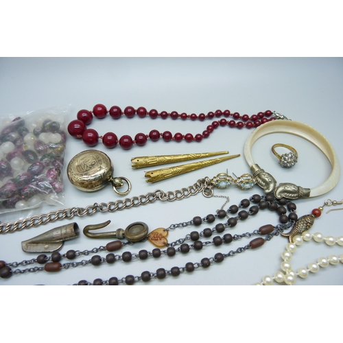 940 - A plated sovereign holder and costume jewellery