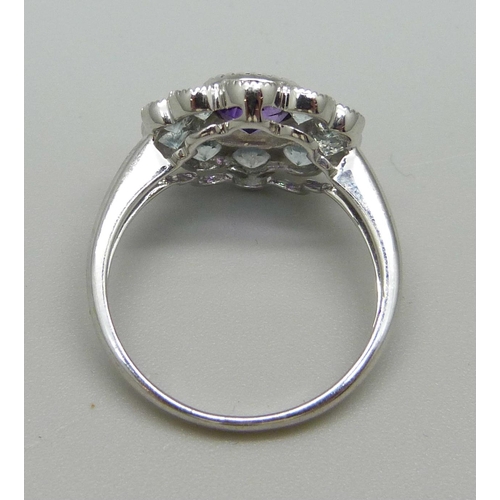 945 - A 9ct white gold, amethyst and aquamarine ring, 3.3g, O