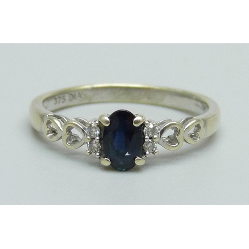 948 - A 9ct white gold, sapphire and diamond ring, 1.7g, N