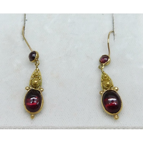 961 - A pair of yellow metal and garnet drop earrings, 2.3g