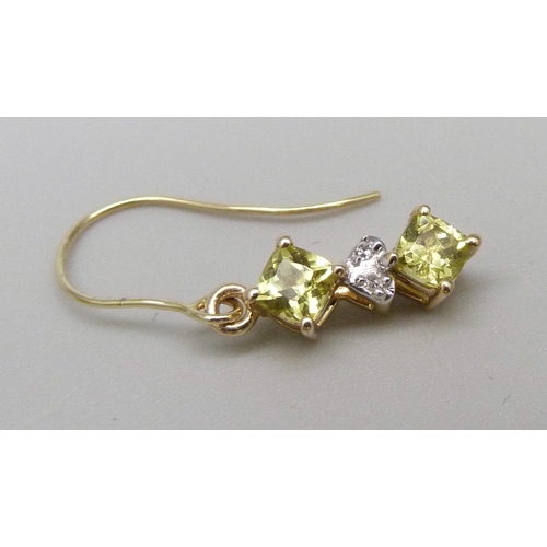 964 - A pair of 9ct gold, yellow garnet and diamond drop earrings, 1.5g