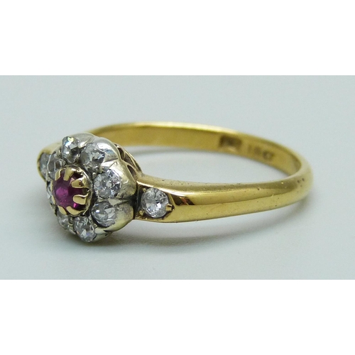 968 - An 18ct gold, ruby and diamond cluster ring, 2.9g, O