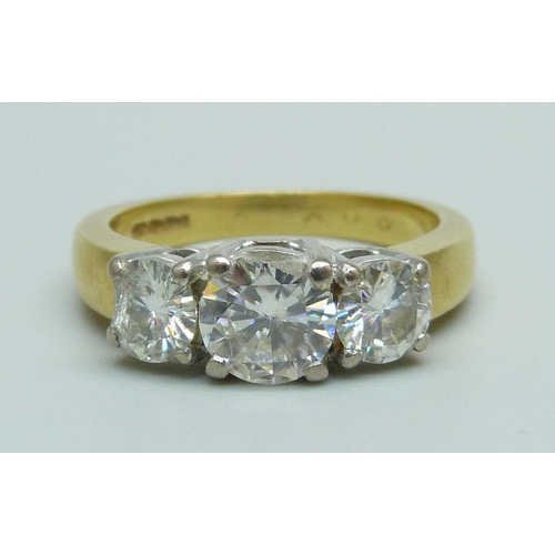 973 - An 18ct gold, three stone diamond ring, 6.3g, O, stones a/f (diamond on the left of image with large...