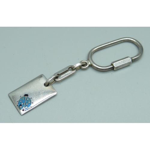 976 - A silver and enamel key ring