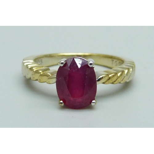 978 - A silver gilt and ruby solitaire ring, J