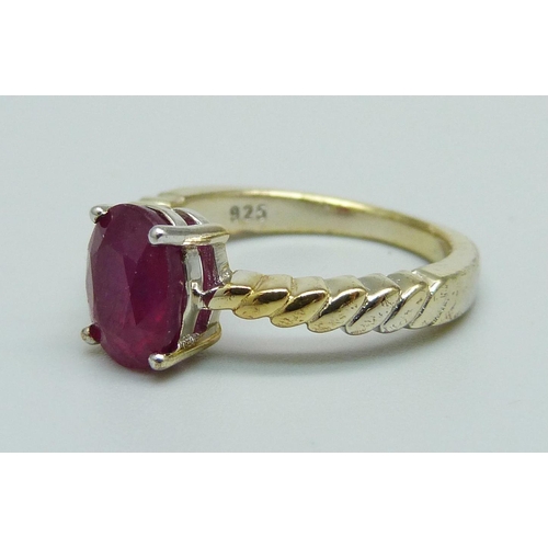 978 - A silver gilt and ruby solitaire ring, J