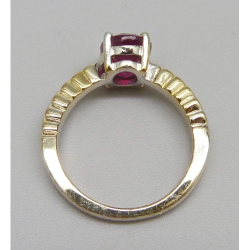 978 - A silver gilt and ruby solitaire ring, J