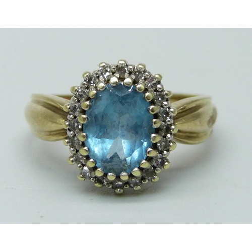 990 - A 9ct gold, diamond and blue stone ring, 3.5g, K