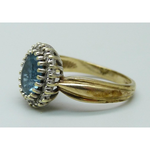 990 - A 9ct gold, diamond and blue stone ring, 3.5g, K