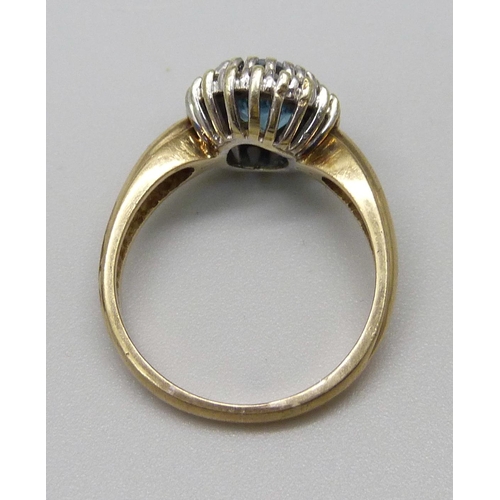 990 - A 9ct gold, diamond and blue stone ring, 3.5g, K