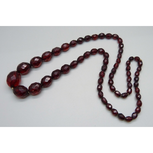 997 - A sherry amber coloured faceted Bakelite bead necklace