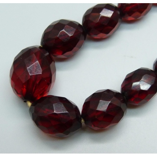 997 - A sherry amber coloured faceted Bakelite bead necklace