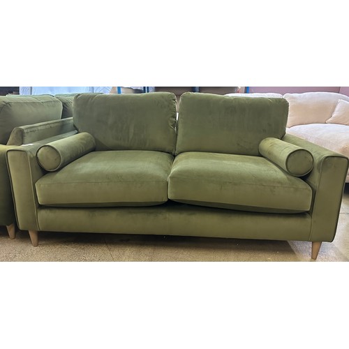 1494 - Green velvet three seater sofa