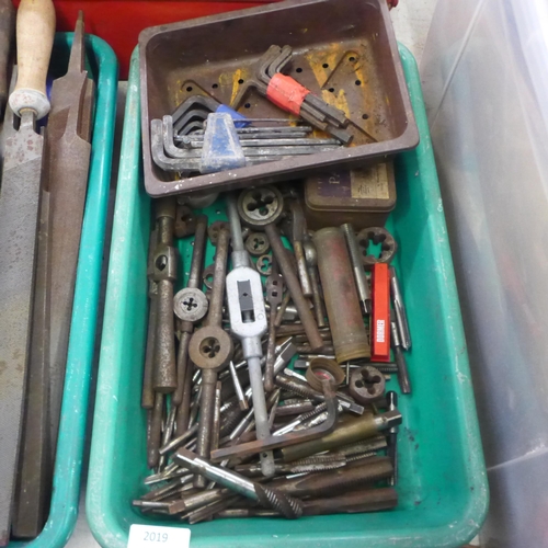 2019 - A tool box and three trays of assorted tools including wooden tool handles, allen keys, taps and die... 