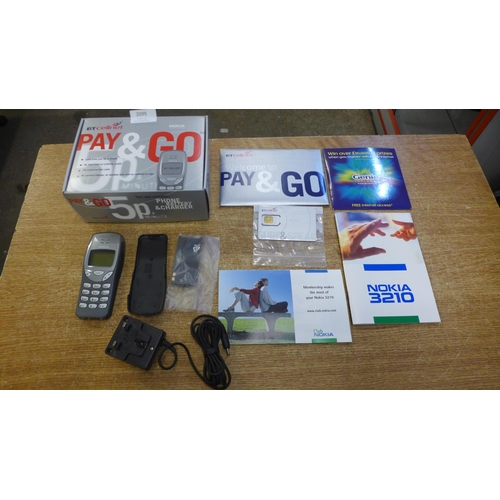 2099 - A Nokia NSE-8 model 3210 mobile phone - boxed with battery and charger