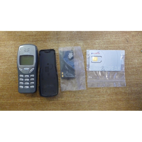 2099 - A Nokia NSE-8 model 3210 mobile phone - boxed with battery and charger