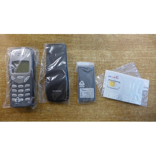 2100 - A Nokia NSE-8 model 3210 mobile phone - boxed with battery and charger