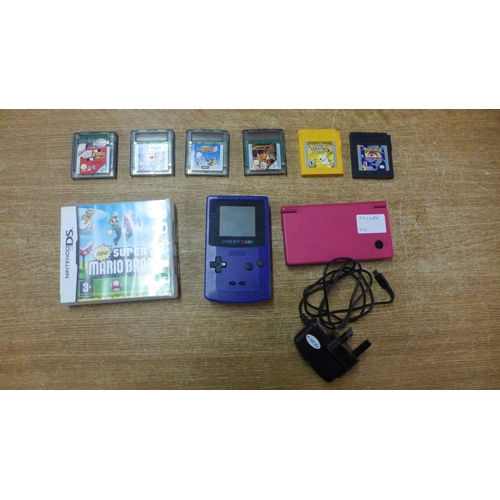 2119A - A purple Gameboy Colour with a collection of games including Pokémon yellow, Pokémon Trading Card Ga... 