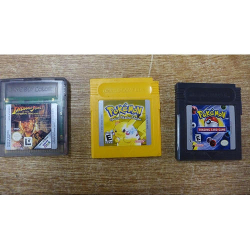 2119A - A purple Gameboy Colour with a collection of games including Pokémon yellow, Pokémon Trading Card Ga... 