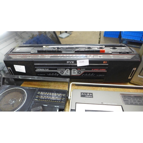 2135 - A quantity of portable radios including a Ferguson 3 band radio cassette recorder, a Steepletone SAB... 