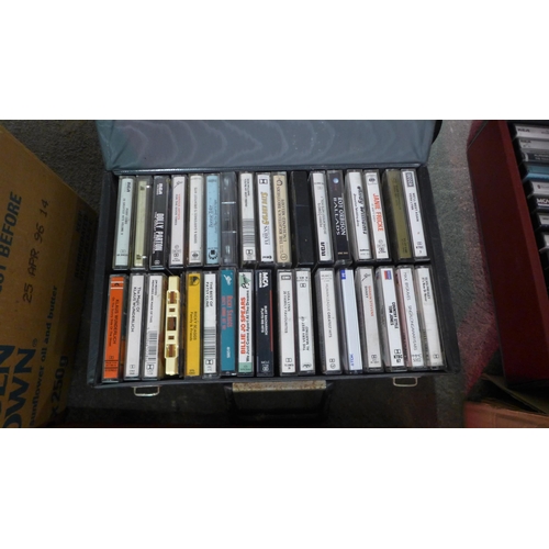 2150 - A large quantity of assorted cassette tapes in a variety of different genres