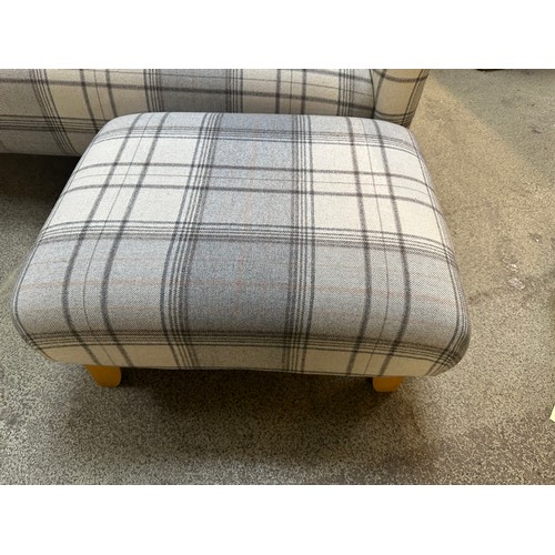 1518 - A grey tartan upholstered two seater sofa and footstool