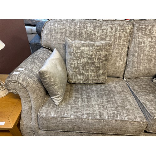 1520 - A mink upholstered three seater sofa