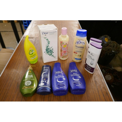 2367 - A box of various cosmetics including: Schwarzkopf essence ultime shampoo, St Ives moisturising showe... 