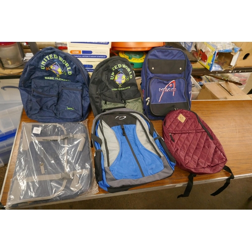 2374 - A canvas bag and five rucksacks