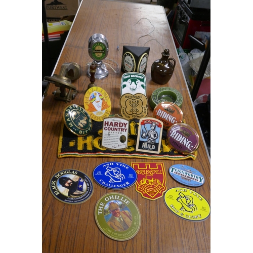 2374A - A box of assorted pub/ bar items including: a Whitebread and co ash tray, a guzzling goose pump clip... 