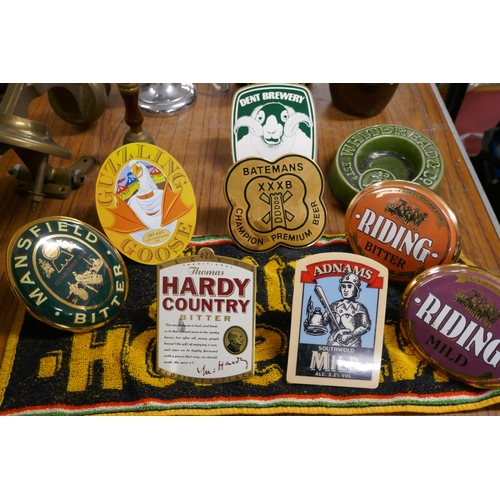 2374A - A box of assorted pub/ bar items including: a Whitebread and co ash tray, a guzzling goose pump clip... 