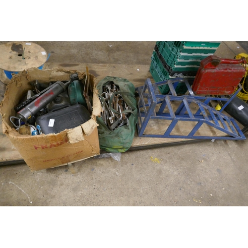 2408 - A large quantity of car items: petrol cans, ramps, paint, grease gun, etc.