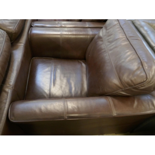 1561 - A brown leather three seater sofa, two arm chairs and footstool