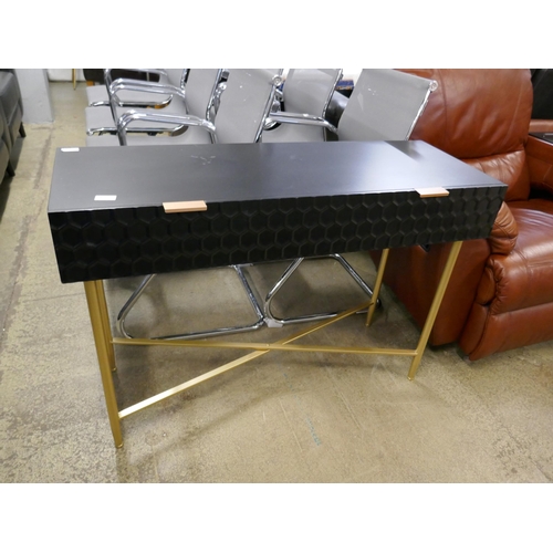 1575 - A black console table with gold legs