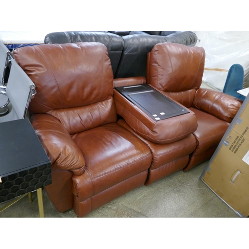 1576 - A tan leather three seater sofa