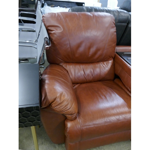 1576 - A tan leather three seater sofa