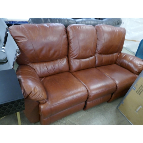 1576 - A tan leather three seater sofa