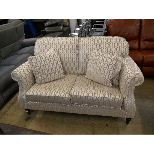 1579 - A light mink velvet two seater sofa