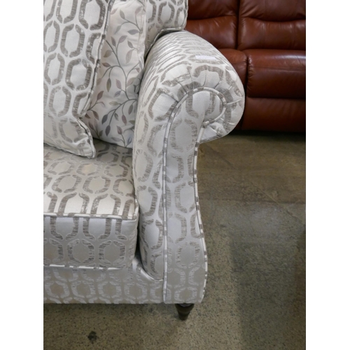 1579 - A light mink velvet two seater sofa