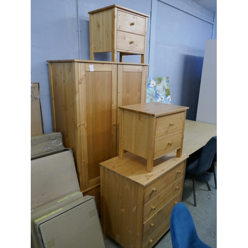 1608 - A pine wardrobe, a chest of drawers and a pair of bedside chests - boxed * this lot is subject to VA... 