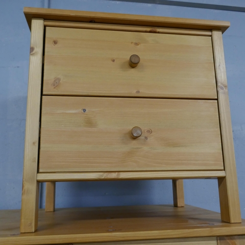 1608 - A pine wardrobe, a chest of drawers and a pair of bedside chests - boxed * this lot is subject to VA... 