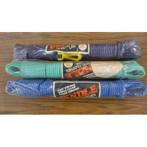 2253 - Three assorted lengths of nylon rope, four assorted plastic clothes lines, two 180ml tins of iron ga... 