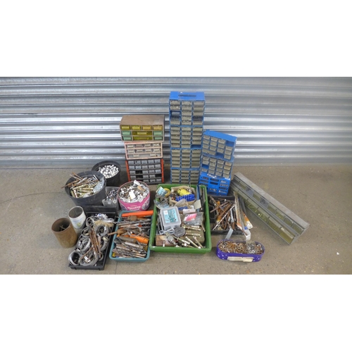 2303 - A large amount of trays buckets and workshop organisers of screws, nuts, bolts, hollow wall fixing b... 